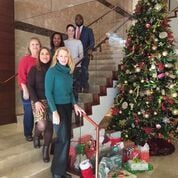 BakerHostetler attorneys with their Adopt-a-Family presents